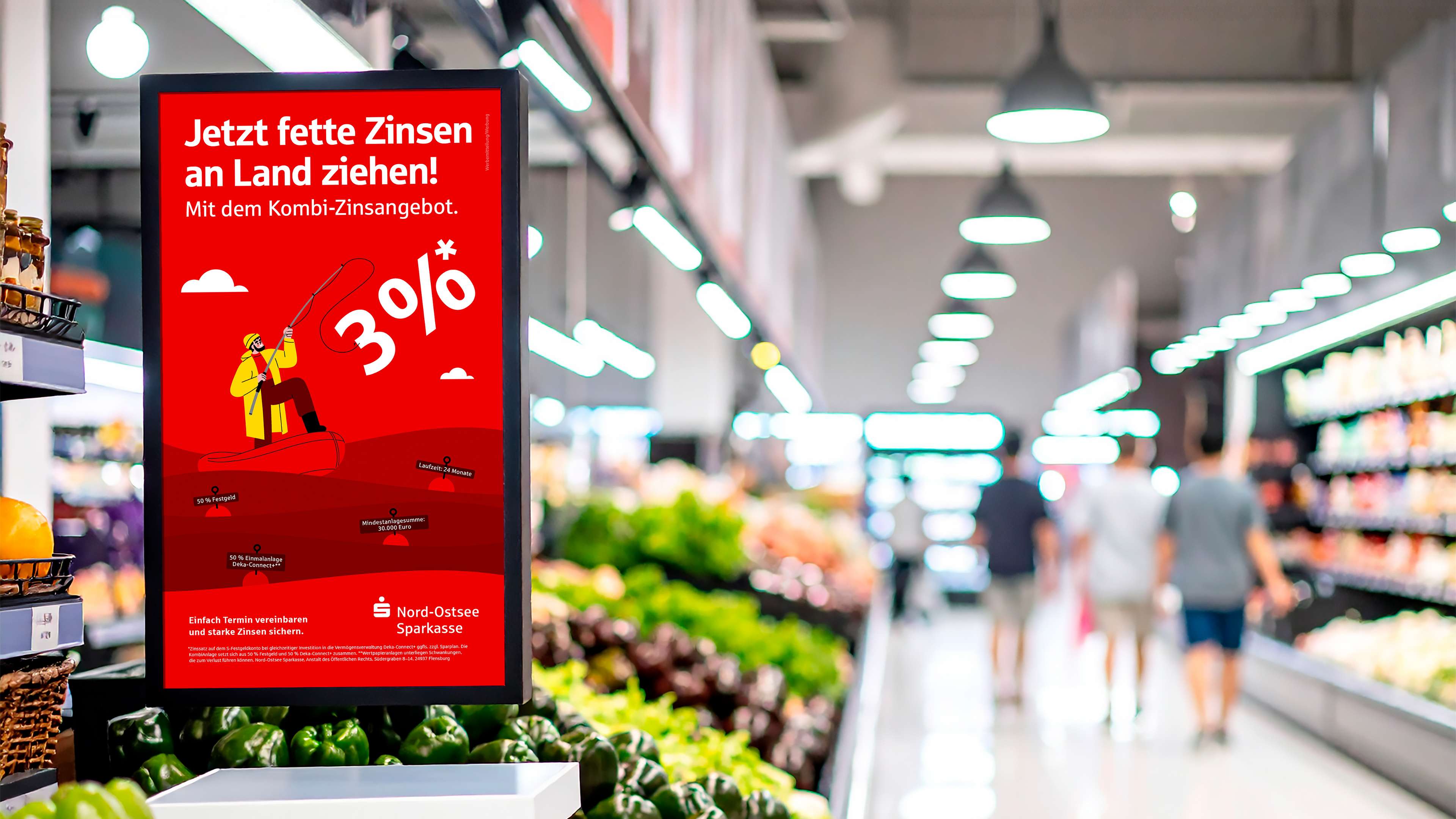 Digitale Anzeige im Supermarkt zeigt nospa-Kampagne in Gemüseabteilung