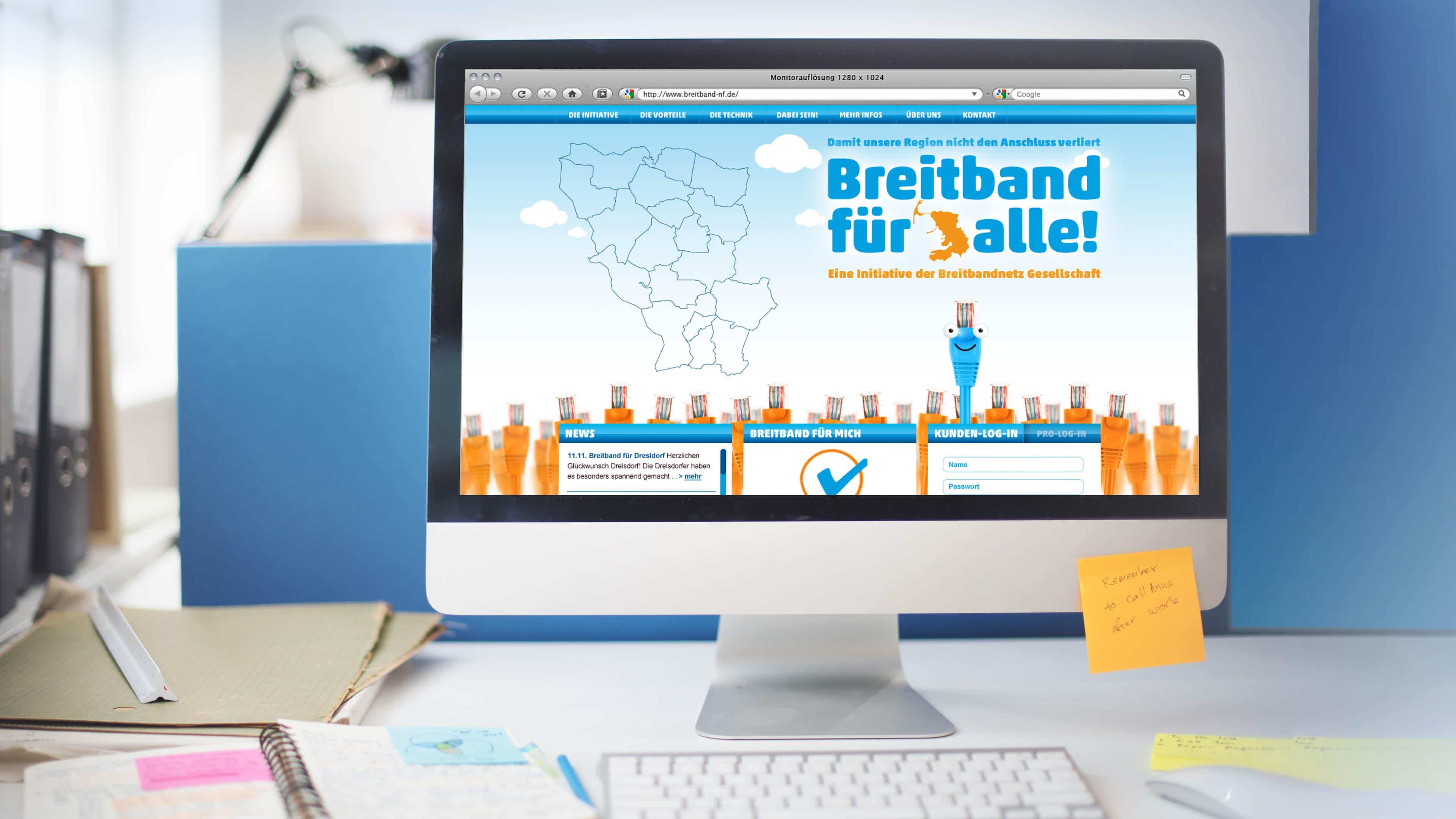 hochzwei_breitband_slider_01.jpg iMac auf Schreibtisch das die Website breitband-nf.de zeigt