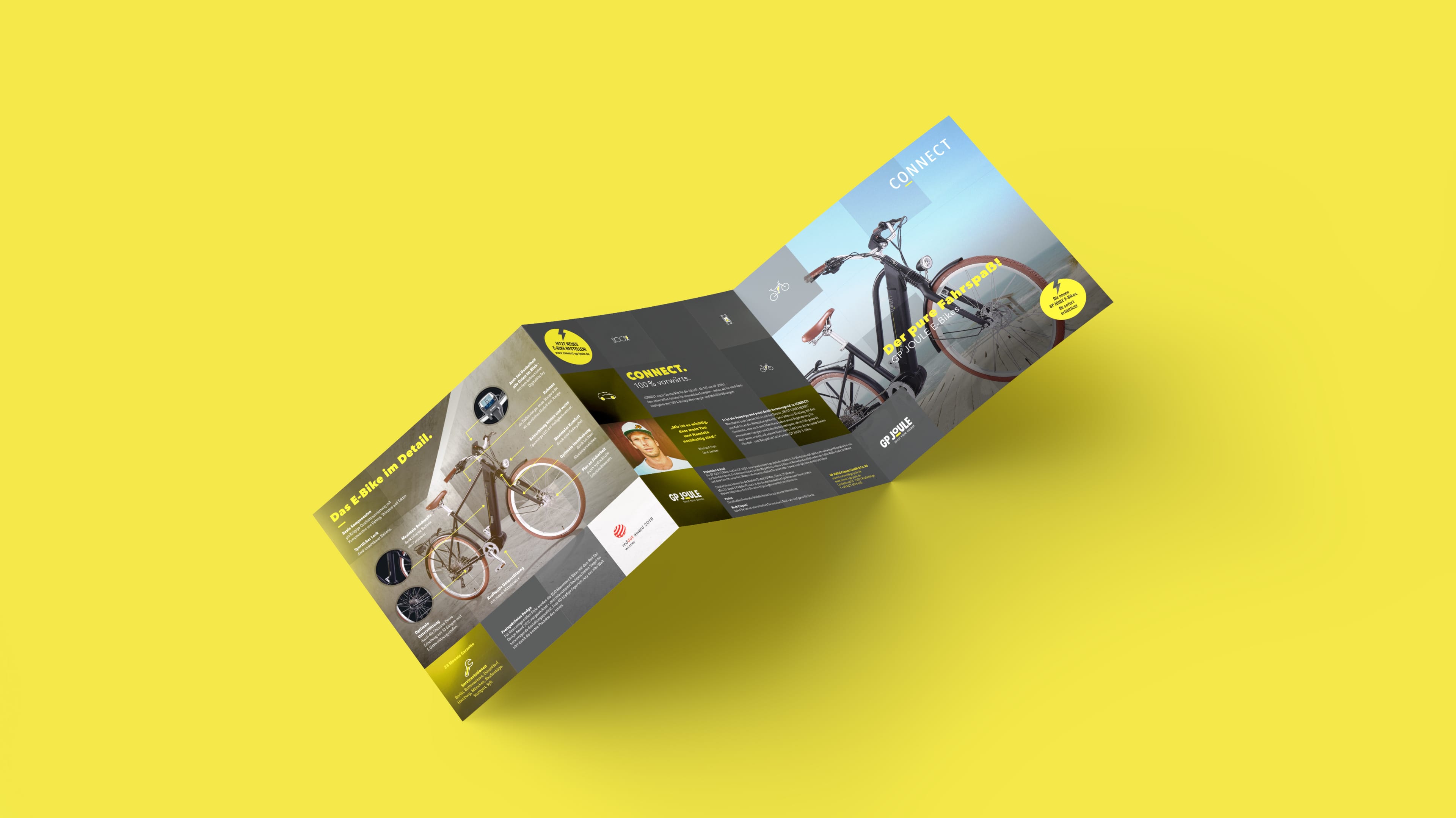 hochzwei_gpjoule_slider_03.jpg Schwarzer Klappbarer Flyer von GP Joule auf einem gelben Hintergrund