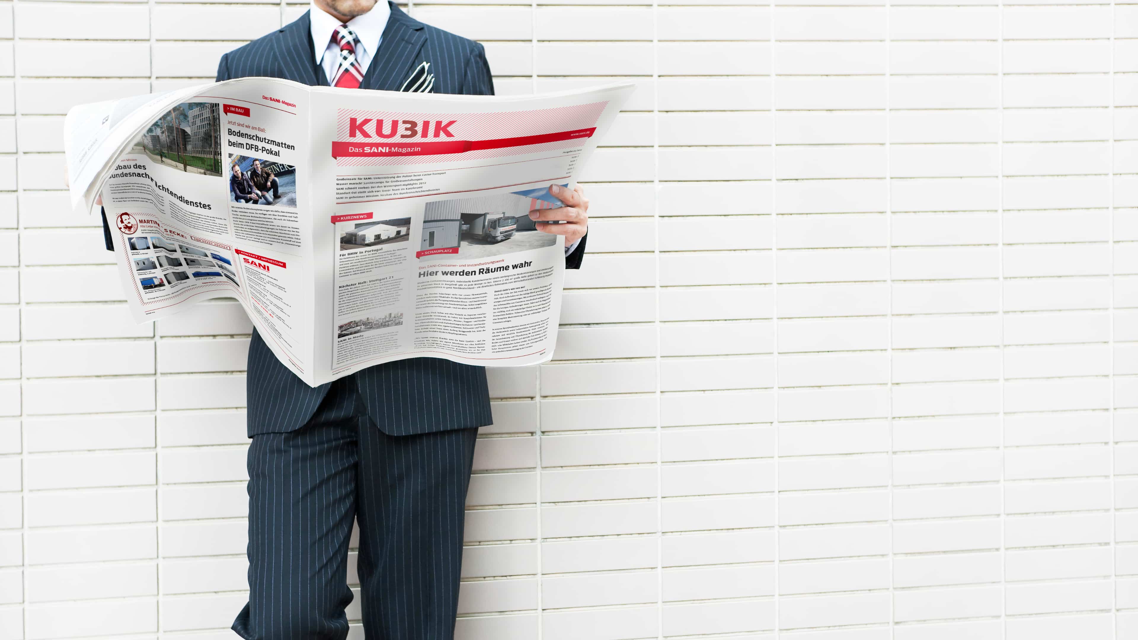 hochzwei_sani_slider_02.jpg Mann hält Zeitung in der Hand