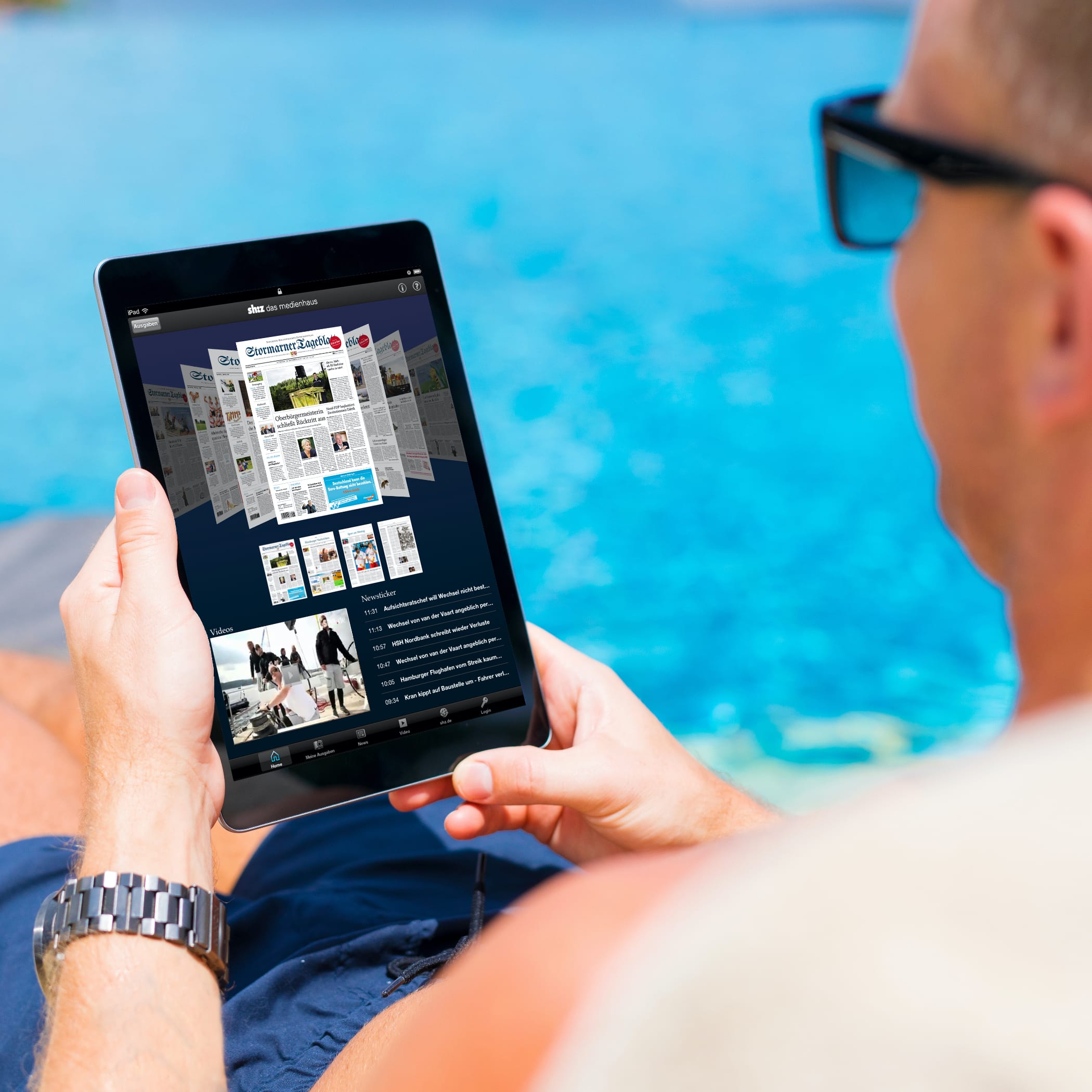 hochzwei_shz_teaser_04.jpg Mann liest das Stormaner Tageblatt auf dem Ipad am Pool