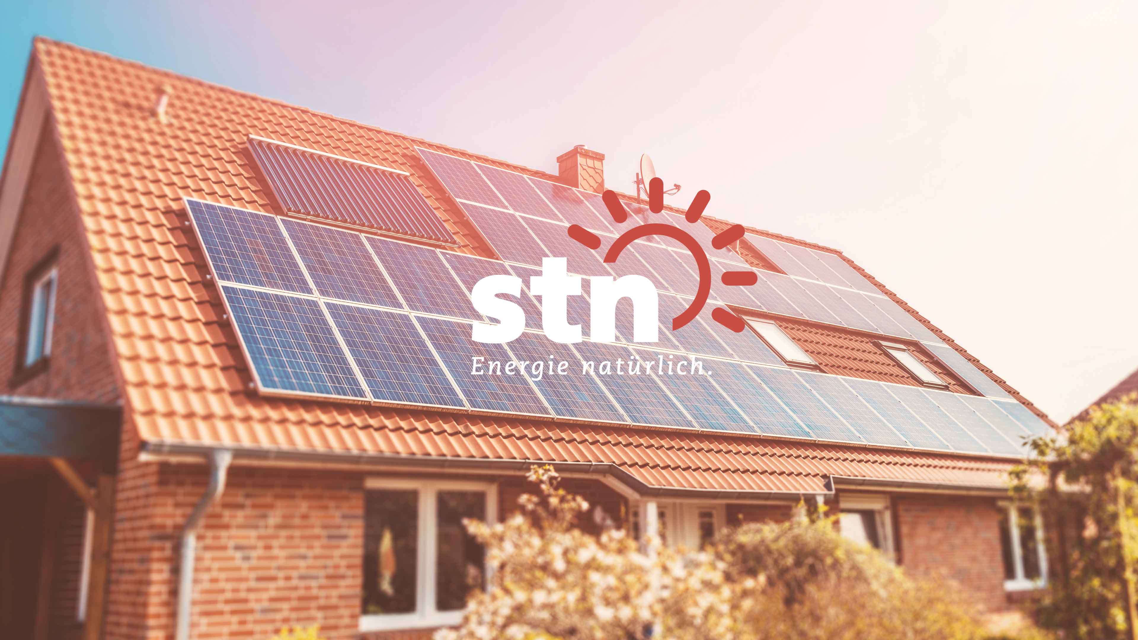 Neubaushaus mit stn Logo als overlay