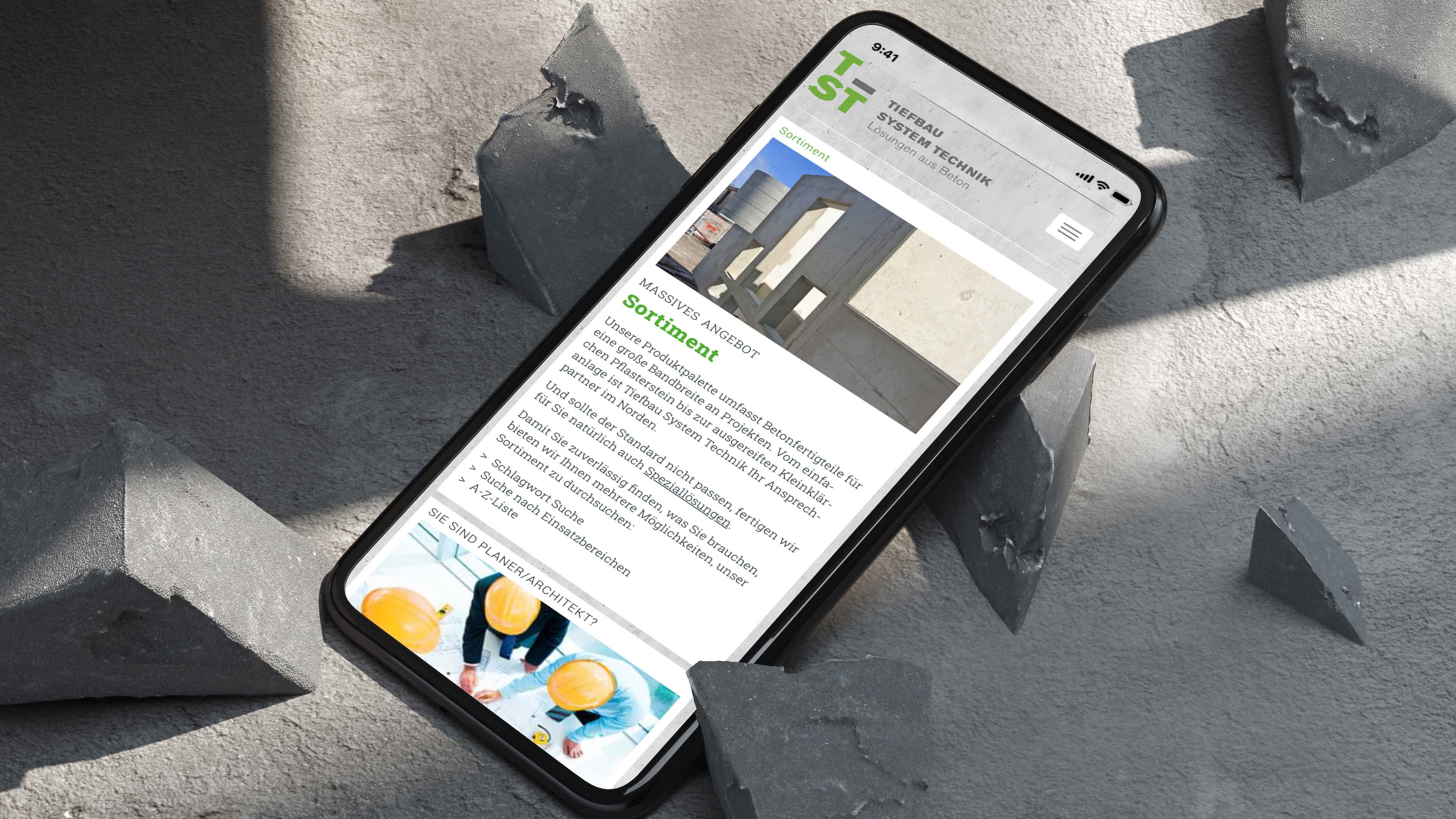 hochzwei_tiefbau_slider_01.jpg Schwarzes Smartphone liegt auf grauen Beton