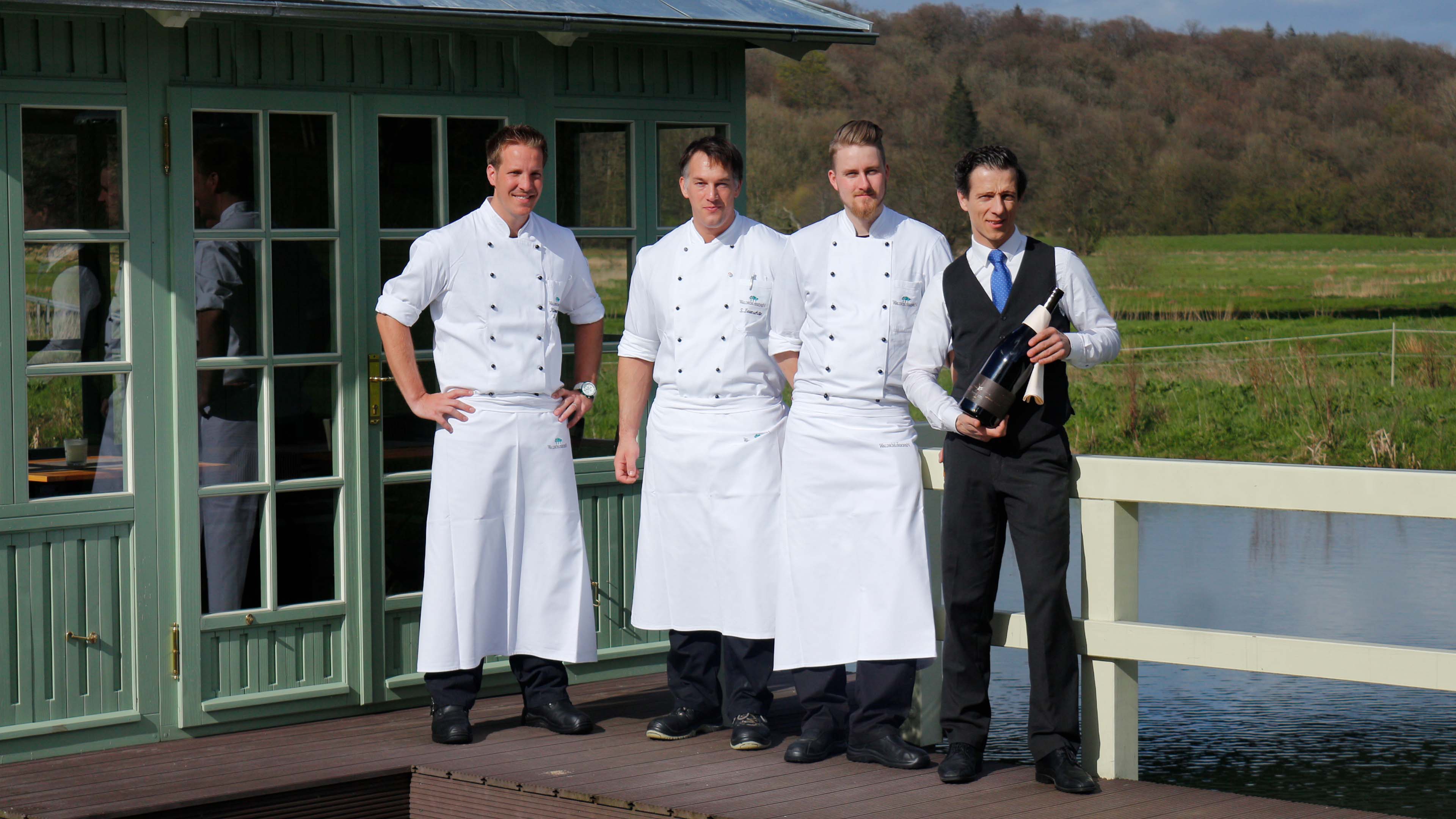 Drei Köche auf einem Steg