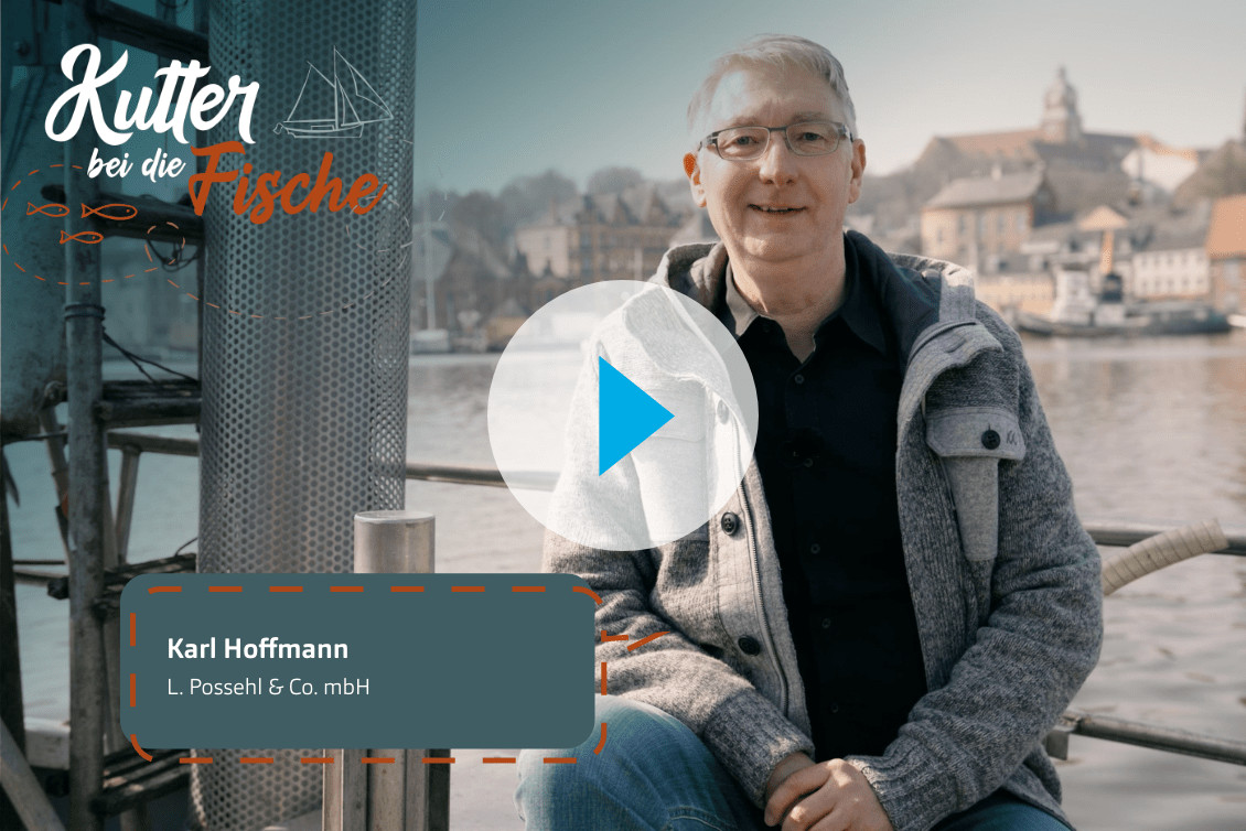 h2_video_1130x754_kbdf_folge14.png Standbild von Karl Hoffmann mit einem Playbutton als overlay