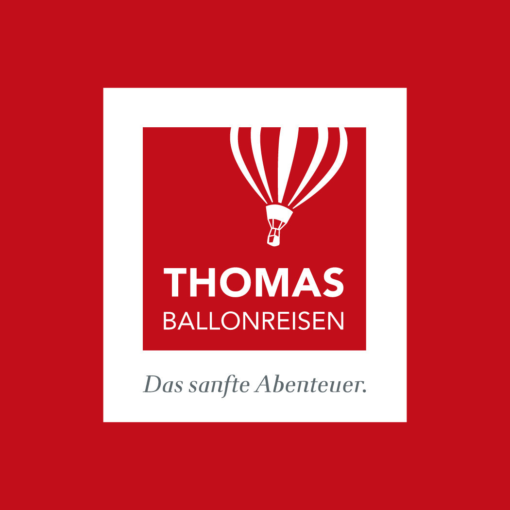 h2_toba_teaser_01.jpg Thomas Ballonreisen Logo in rot und weiß mit einem Umriss eines gesteiften Ballons