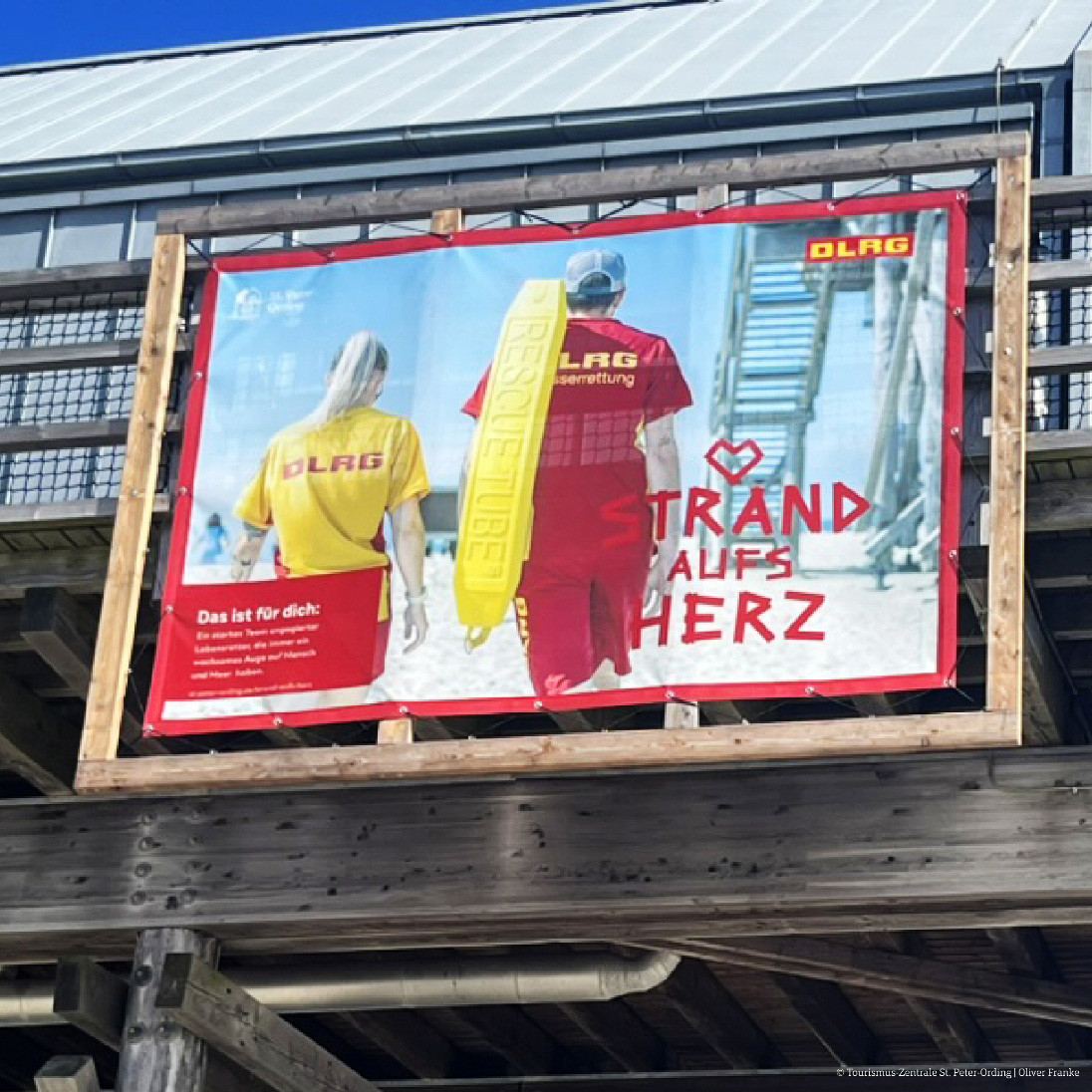 Großflächenplakat DLRG-Motiv Strand aufs Herz