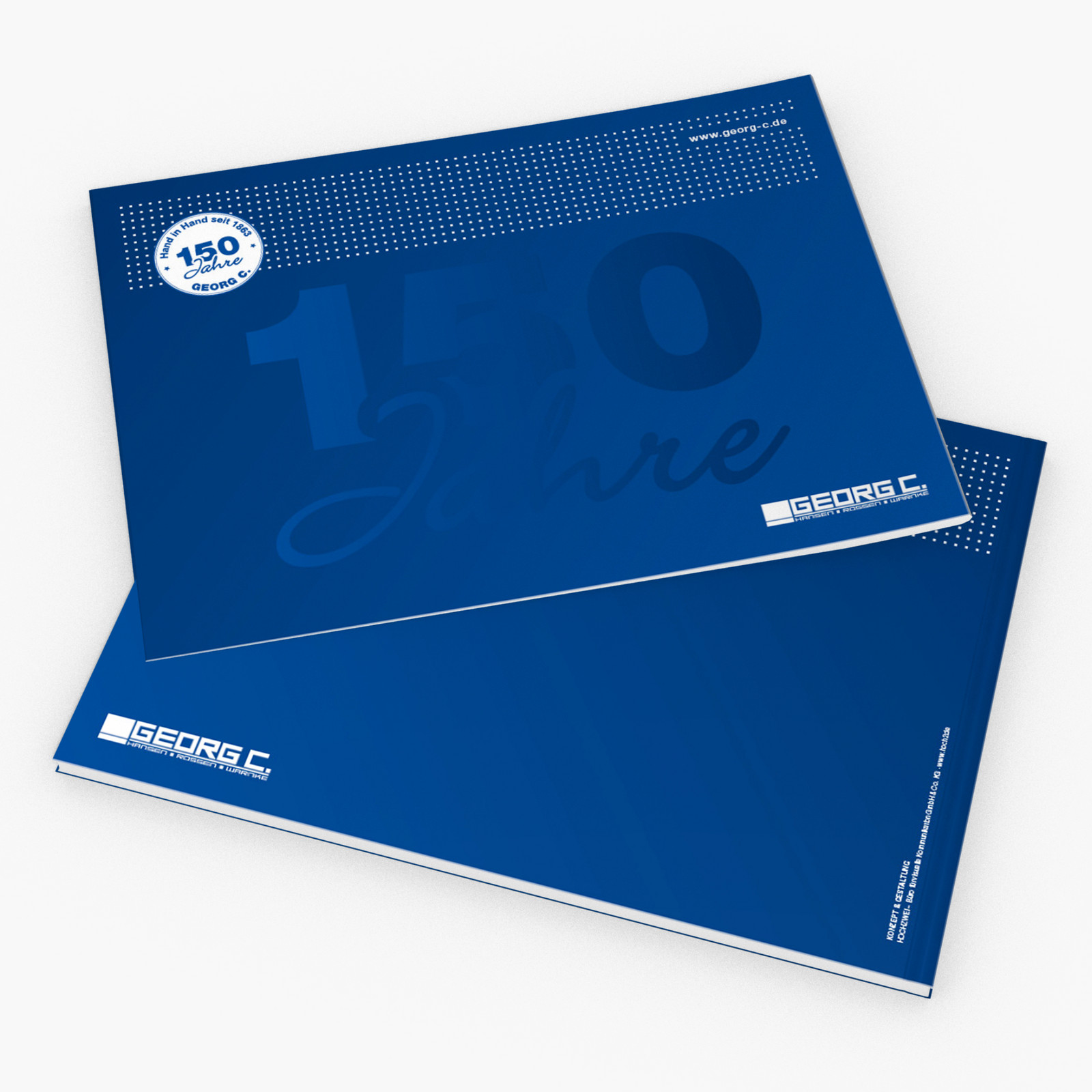 hochzwei_georgc_teaser_03.jpg Zwei blaue Jubiläumshefte von georg C